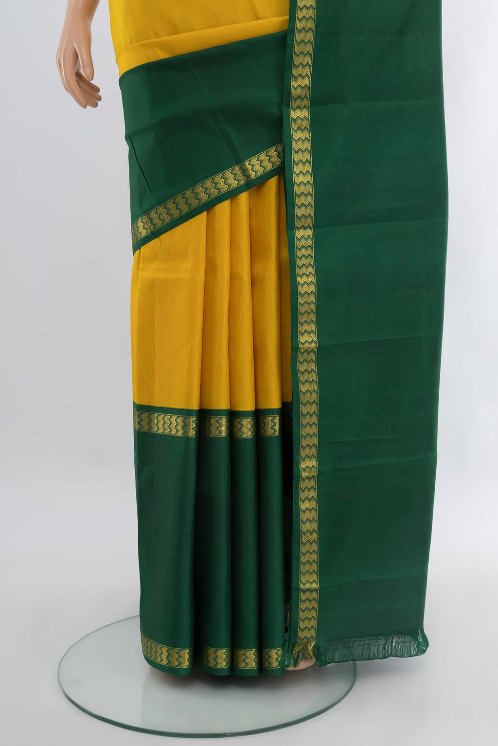 Pleats and pallu of Yellow Kanjivaram Silk Saree with Plain Body and Ganga Jamuna Border. 