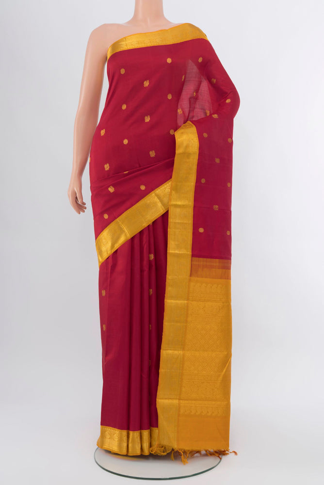 Red Kanjivaram Silk Saree with Zari Brocade on the body and Silk Border.  displayed on a mannequin