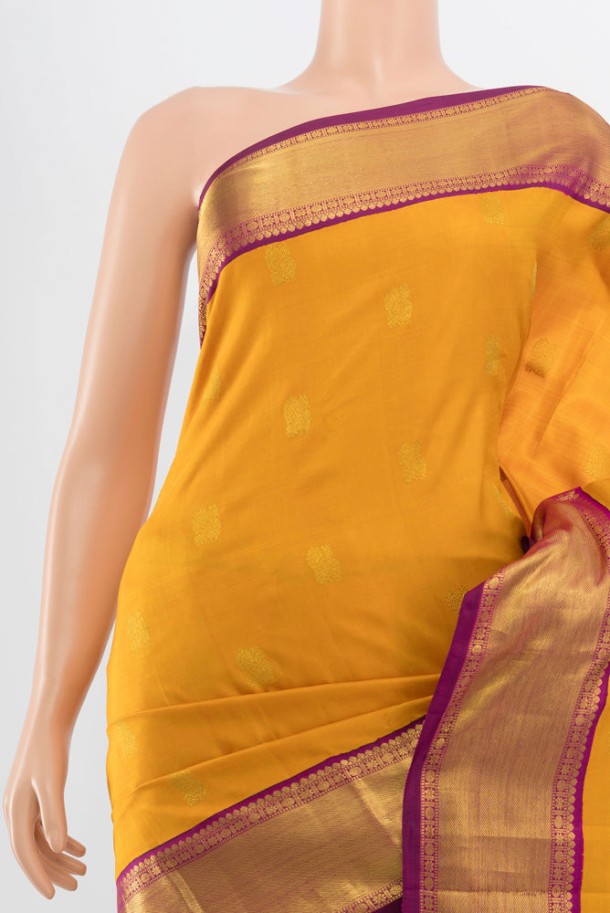 Border image of Pure Silk Pure Zari Mustard Kanjivaram Saree with Zari Butta on the body and Silk Border. 