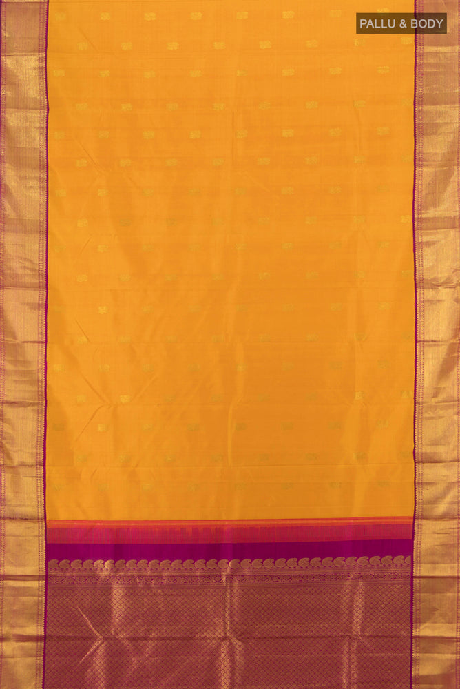 Flat view of Pure Silk Pure Zari Mustard Kanjivaram Saree with Zari Butta on the body and Silk Border. 