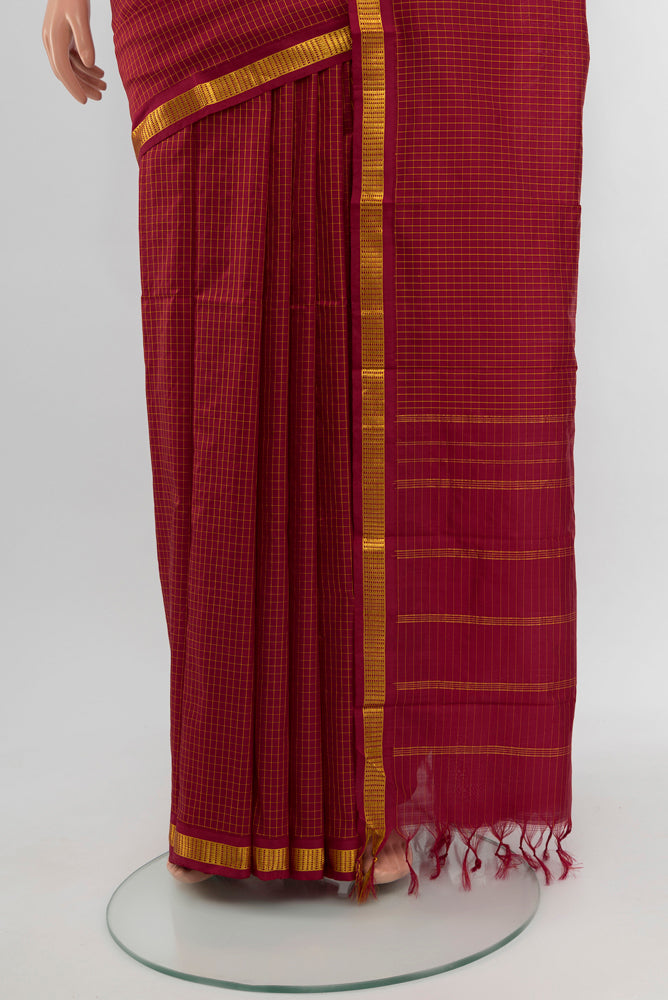 Pleats and pallu of Maroon Kanjivaram Silk Saree with Checked design on the body and Silk Border. 