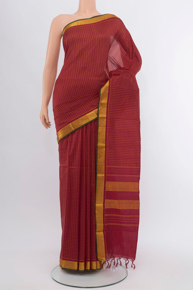 Maroon Kanchipuram Silk Saree with Checked design on the body and Silk Border.  displayed on a mannequin
