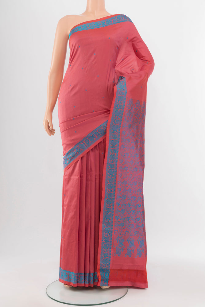 Peach Kanjivaram Silk Saree with Zari Butta on the body and Silk Border.  displayed on a mannequin