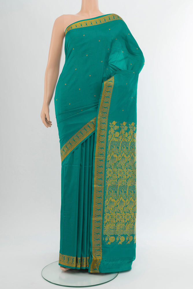 Pure Silk Pure Zari Light Blue Kanjivaram Saree with Jacquard With Thread Butta on the body and Silk Border.  displayed on a mannequin