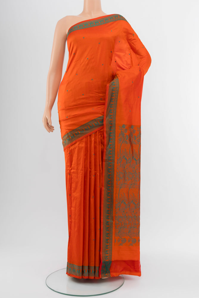Brick Orange Kanjivaram Silk Saree with Jacquard With Thread Butta on the body and Silk Border.  displayed on a mannequin
