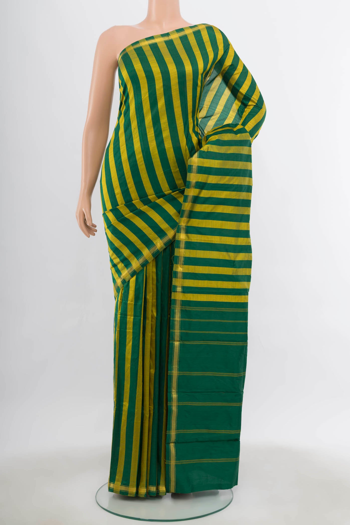 Multi Color Kanchipuram Silk Saree with Zari Butta on the body and Silk Border.  displayed on a mannequin