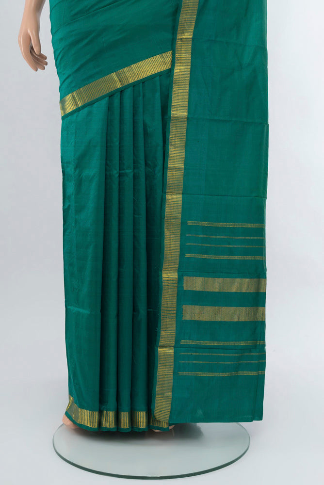 Pleats and pallu of Dark Mauve Kanjivaram Silk Saree with Zari Butta on the body and Silk Border. 