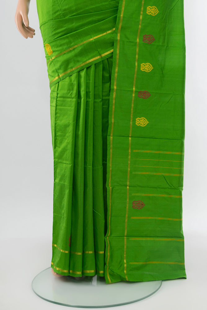 Pleats and pallu of Parrot Green Kanchipuram Silk Saree with Zari Butta on the body and Silk Border. 