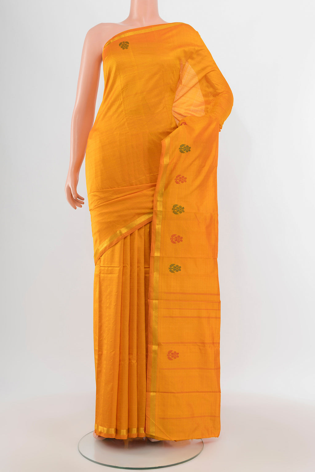Yellow Kanchipuram Silk Saree with Plain Body and Zari Border.  displayed on a mannequin