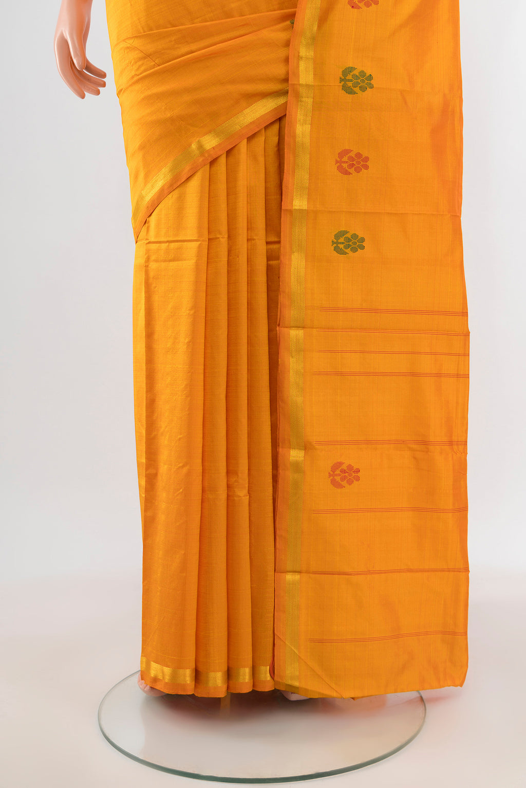 Pleats and pallu of Yellow Kanchipuram Silk Saree with Plain Body and Zari Border. 