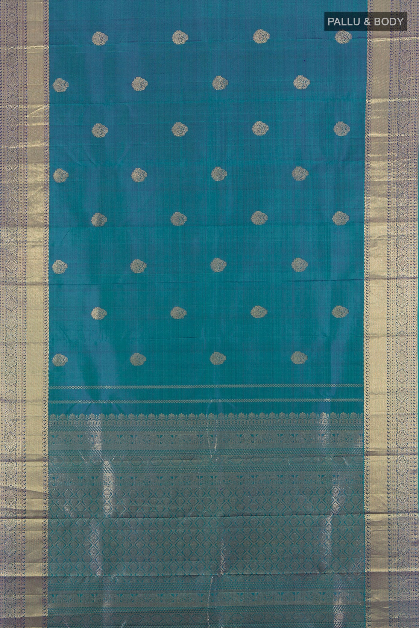 Flat view of Pure Silk Pure Zari Peacock Blue Kanchipuram Saree with Zari Butta on the body and Silk Border. 