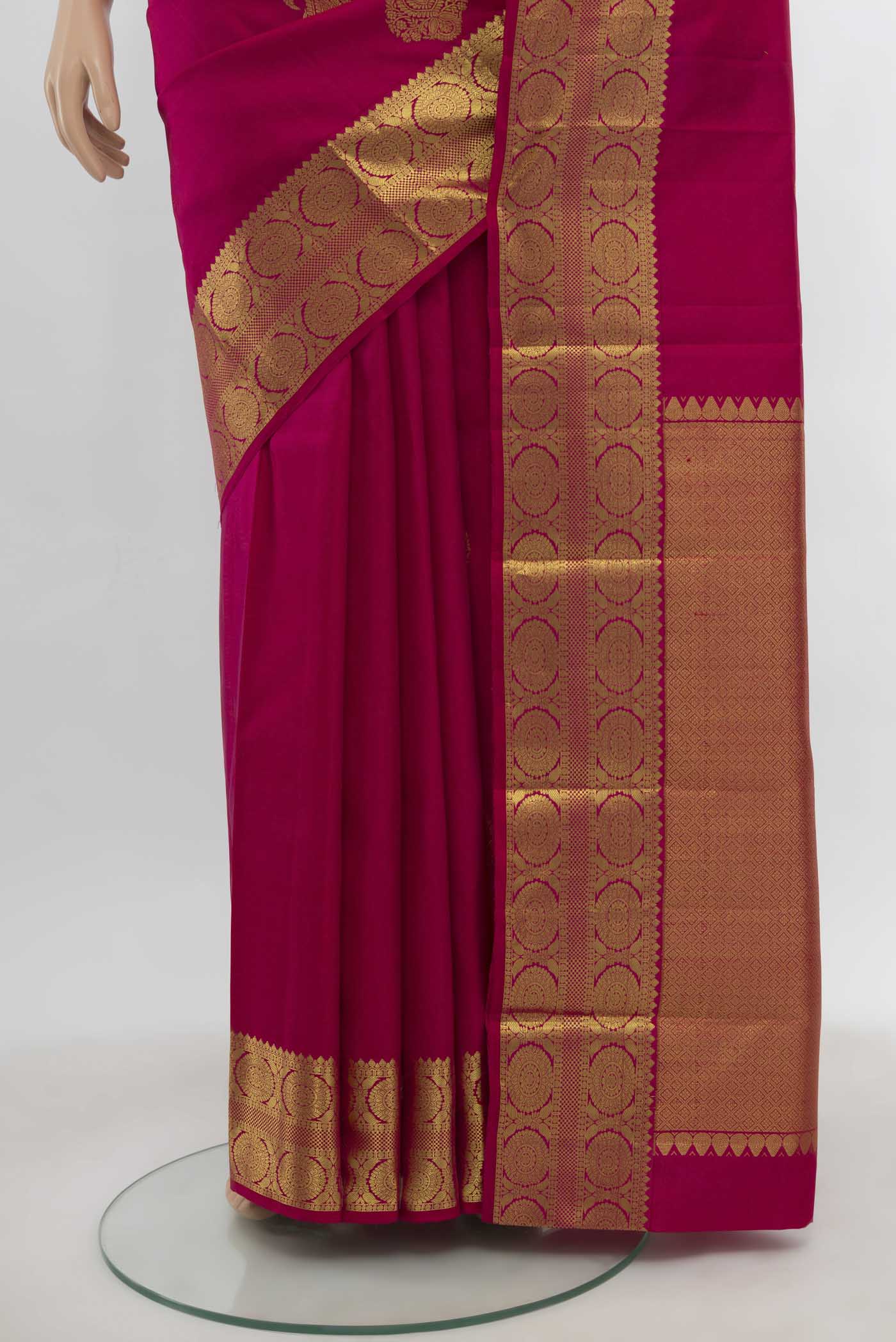 Pleats and pallu of Dark Pink Kanchipuram Silk Saree with Zari Butta on the body and Zari Border. 