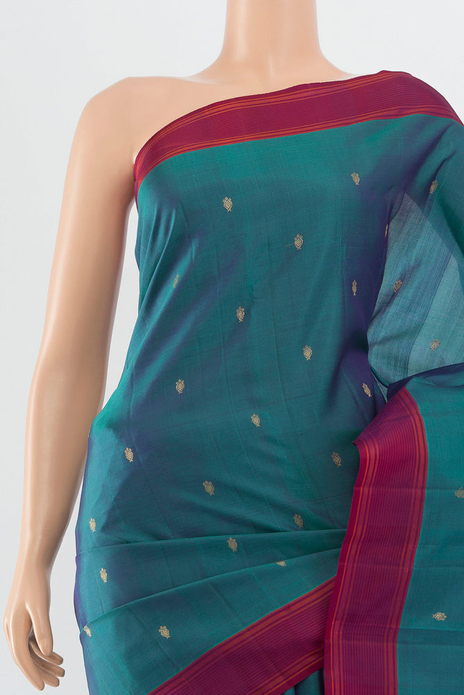 Border image of Peacock Blue Kanchipuram Silk Saree with Zari Butta on the body and Silk Border. 