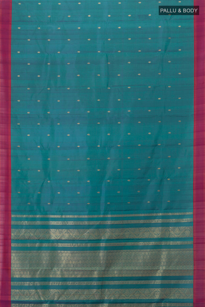 Flat view of Peacock Blue Kanchipuram Silk Saree with Zari Butta on the body and Silk Border. 