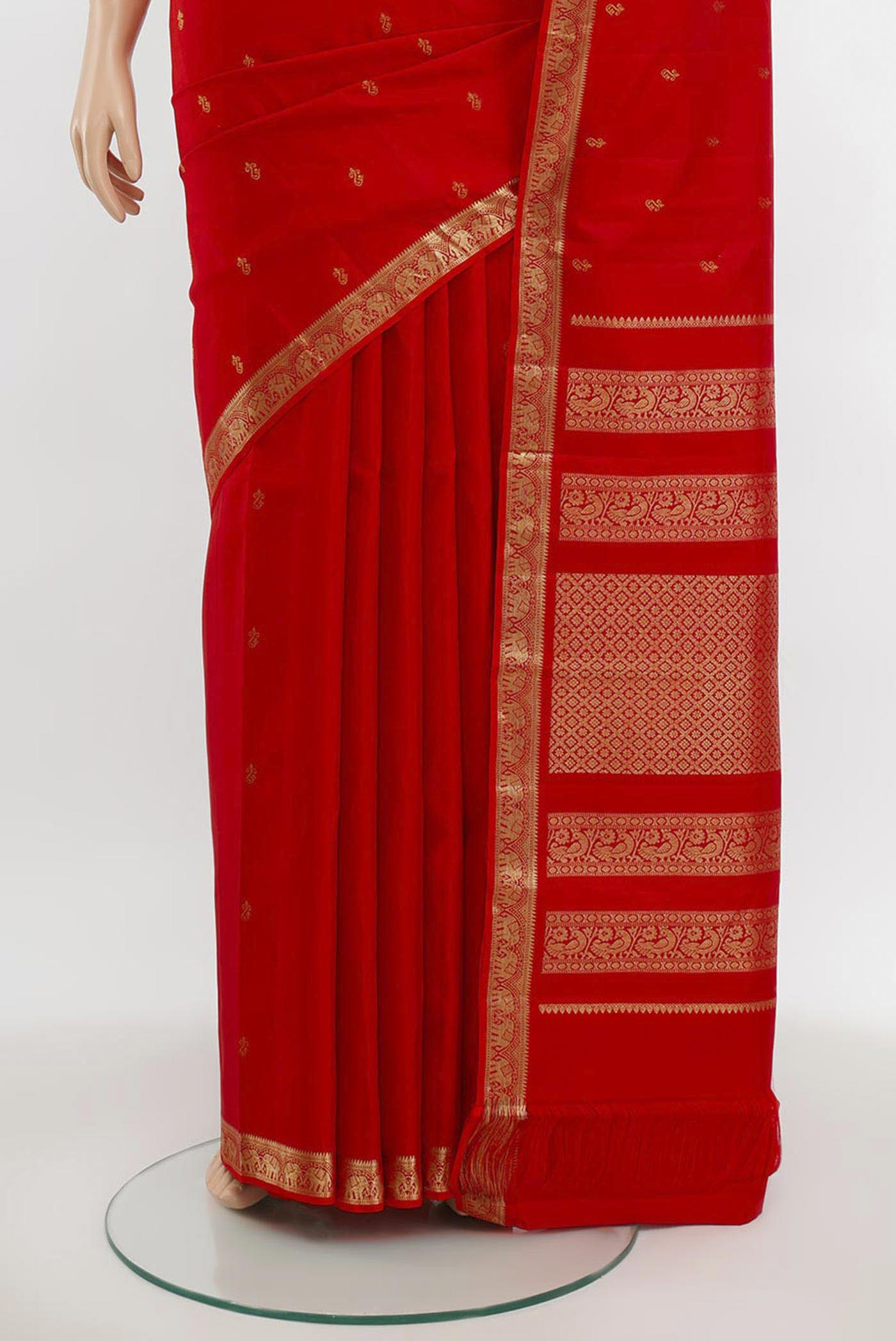 Pleats and pallu of Red Kanchipuram Silk Saree with Zari Butta on the body and Silk Border. 