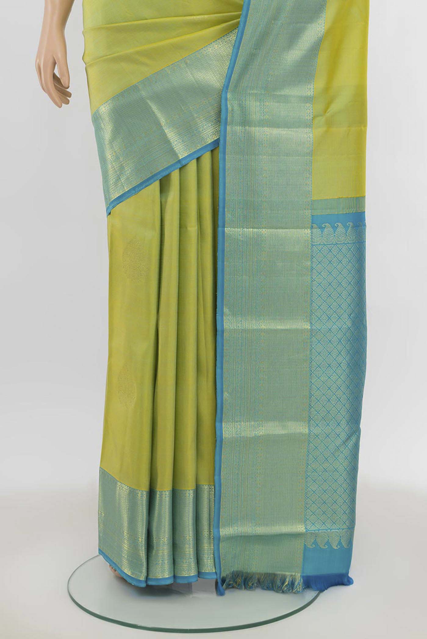Pleats and pallu of Light Green Kanchipuram Silk Saree with Zari Butta on the body and Silk Border. 