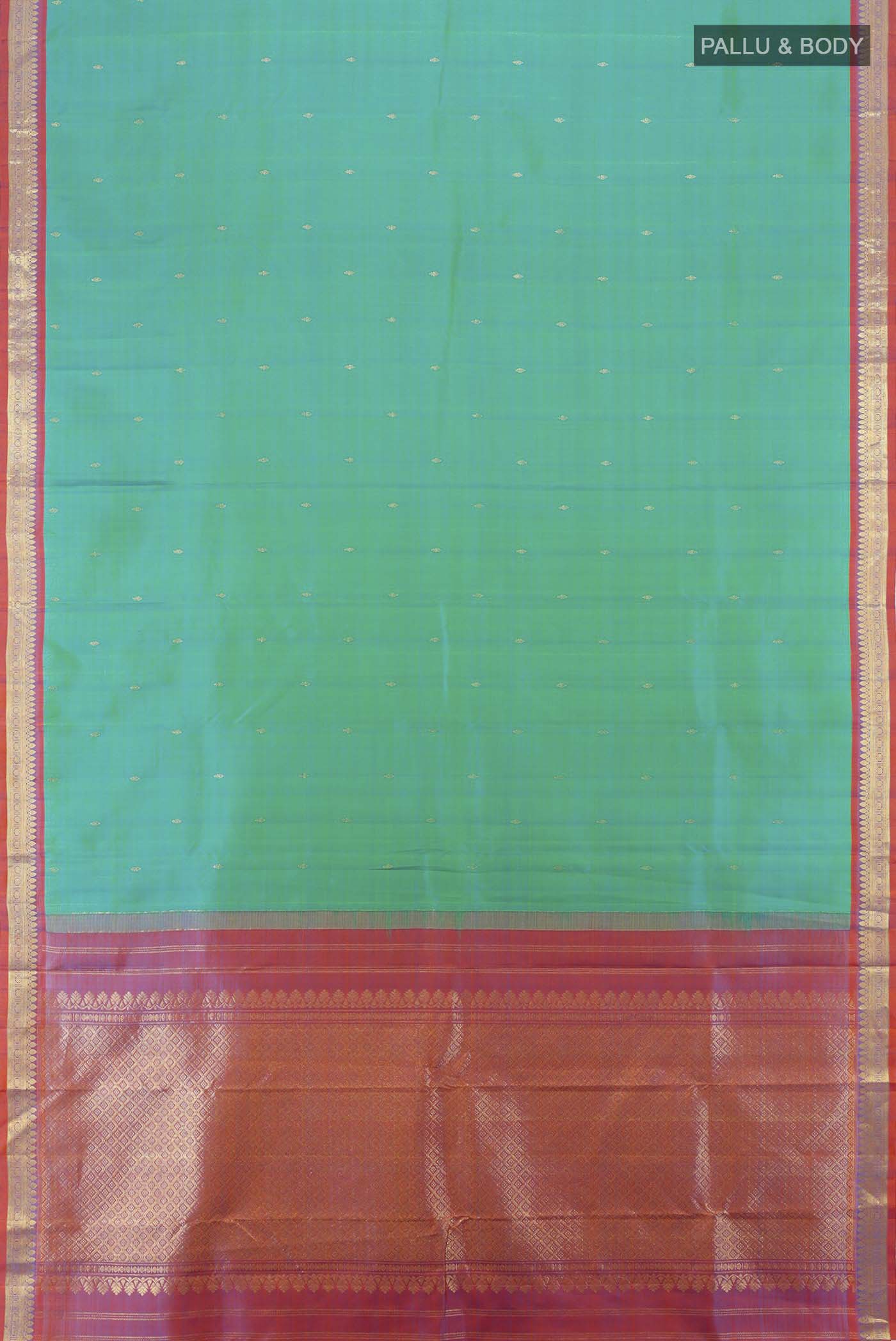 Flat view of Peacock Blue Kanchipuram Silk Saree with Zari Butta on the body and Silk Border. 