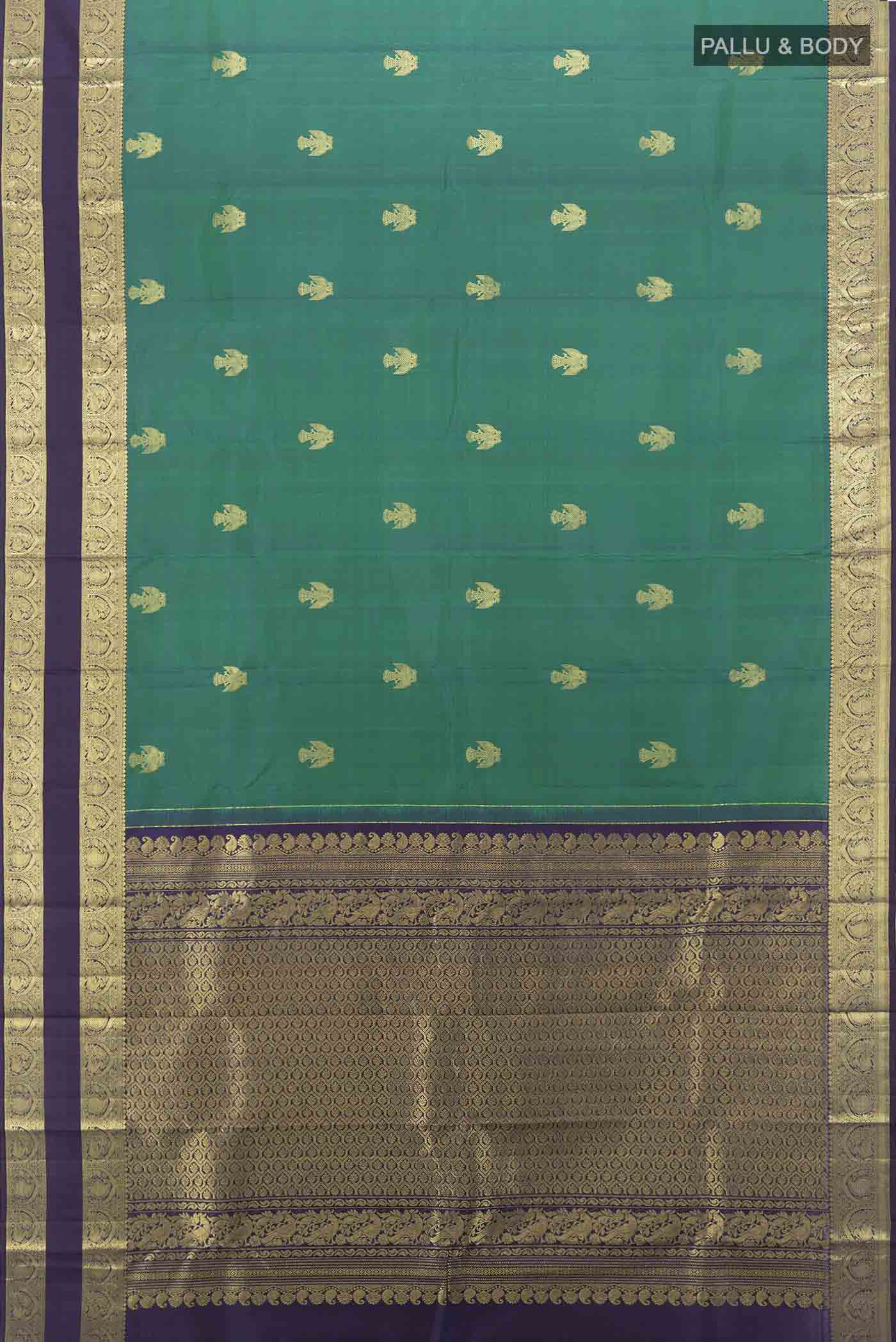 Flat view of Peacock Blue Kanchipuram Silk Saree with Zari Butta on the body and Silk Border. 