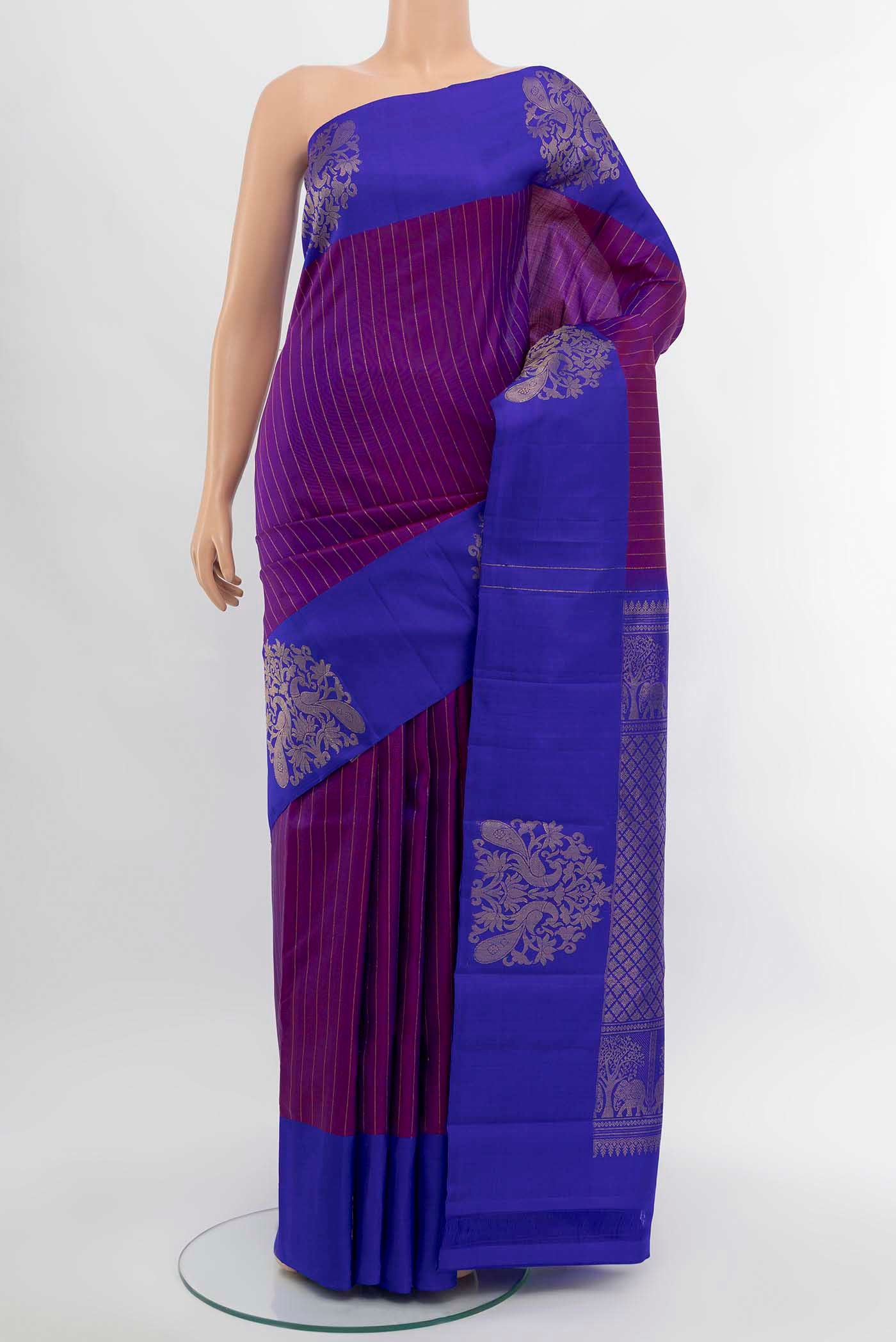 Purple Kanchipuram Silk Saree with Zari Butta on the body and Silk Border displayed on a mannequin