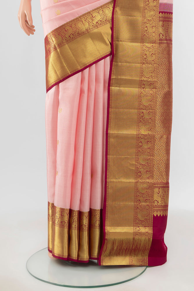 Pleats and pallu of Pure Silk Pure Zari Rose Gold Kanjivaram Saree with Zari Butta on the body and Silk Border. 