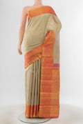 Pure Silk Pure Zari Golden Kanchipuram Saree with Zari Butta on the body and Silk Border.  displayed on a mannequin