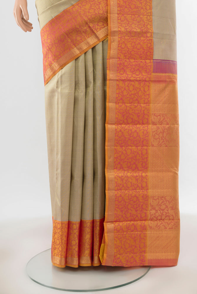 Pleats and pallu of Pure Silk Pure Zari Golden Kanchipuram Saree with Zari Butta on the body and Silk Border. 