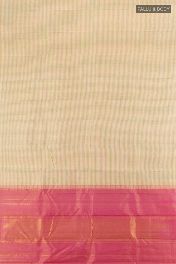 Flat view of Cream Kanjivaram Silk Saree with Zari Butta on the body and Silk Border. 