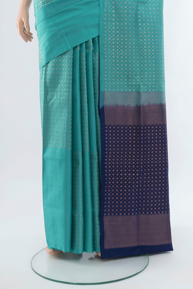Pleats and pallu of Light Blue Soft Silk Saree with Zari Butta on the body and Silk Border. 