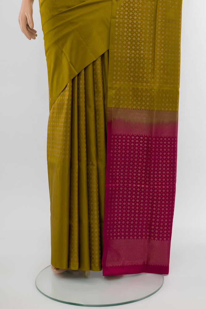 Pleats and pallu of Mehandi Green Soft Silk Saree with Zari Butta on the body and Silk Border. 