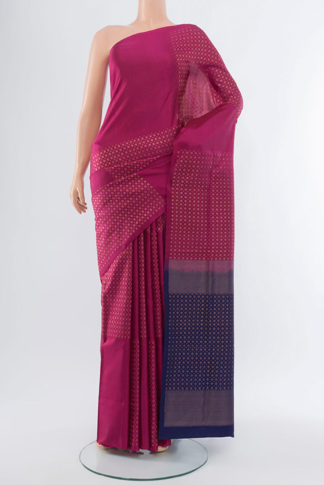 Purple Soft Silk Saree with Zari Butta on the body and Silk Border.  displayed on a mannequin