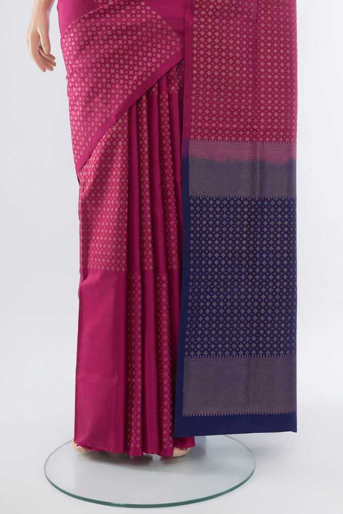 Pleats and pallu of Purple Soft Silk Saree with Zari Butta on the body and Silk Border. 