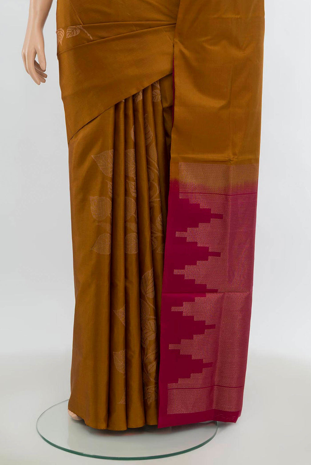 Pleats and pallu of Rust Soft Silk Saree with Zari Butta on the body and Silk Border. 