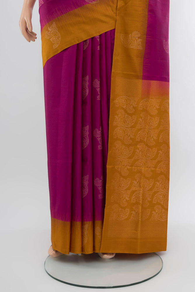 Pleats and pallu of Purple Soft Silk Saree with Zari Butta on the body and Zari Border. 