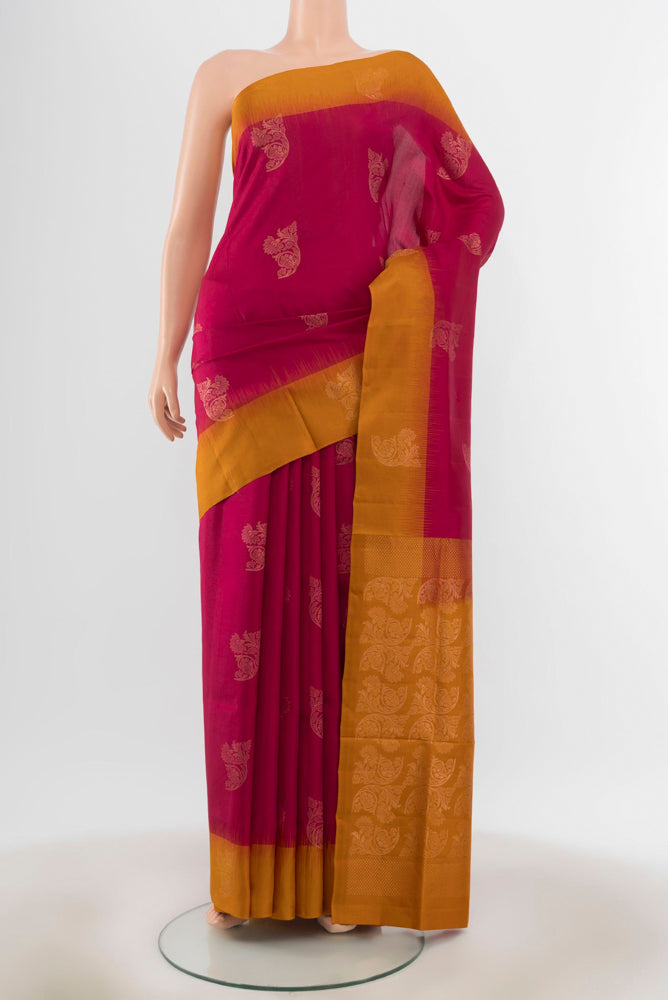 Dark Pink Soft Silk Saree with Zari Butta on the body and Silk Border.  displayed on a mannequin