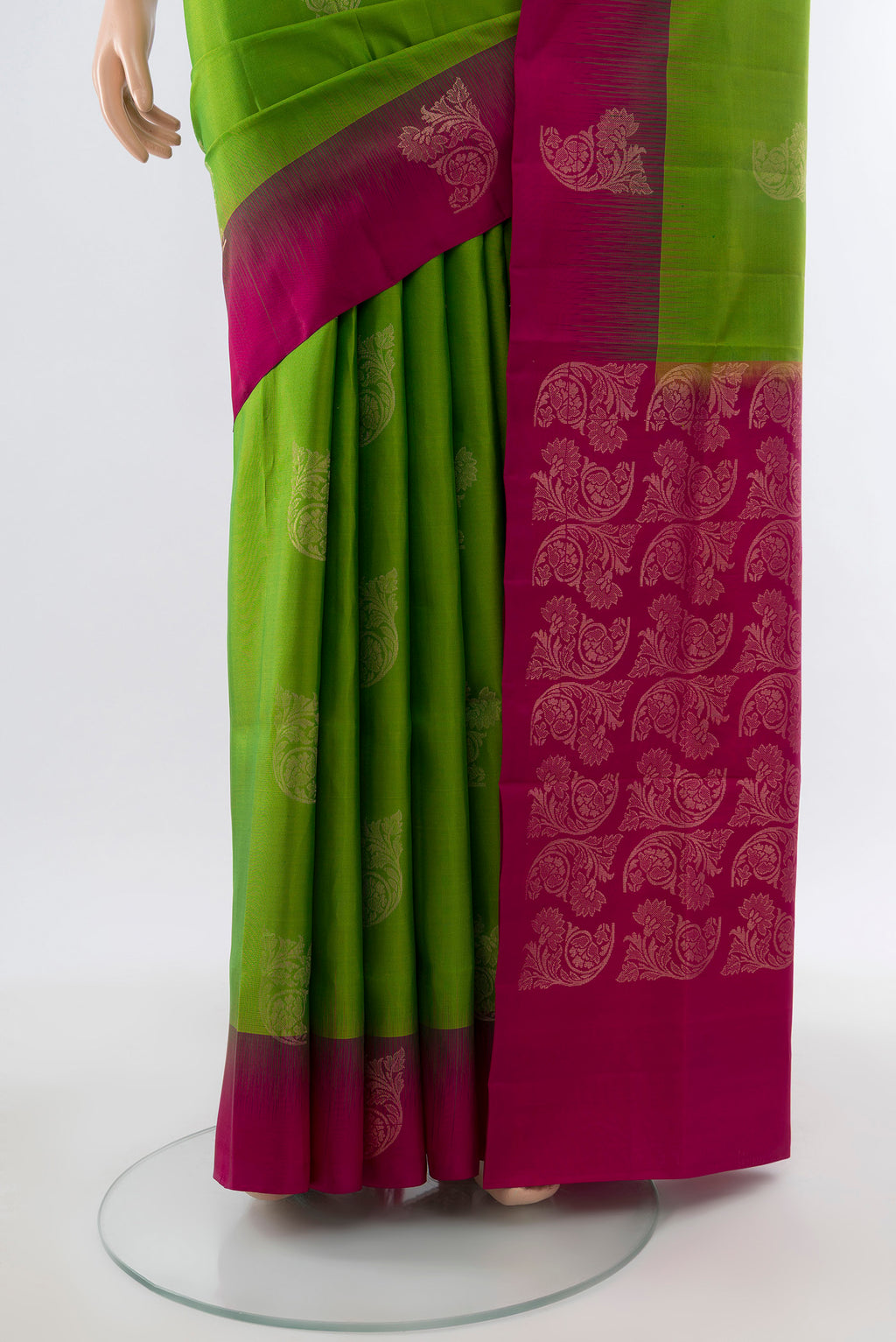 Pleats and pallu of Pure Silk Pure Zari Parrot Green Soft Saree with Zari Butta on the body and Silk Border. 