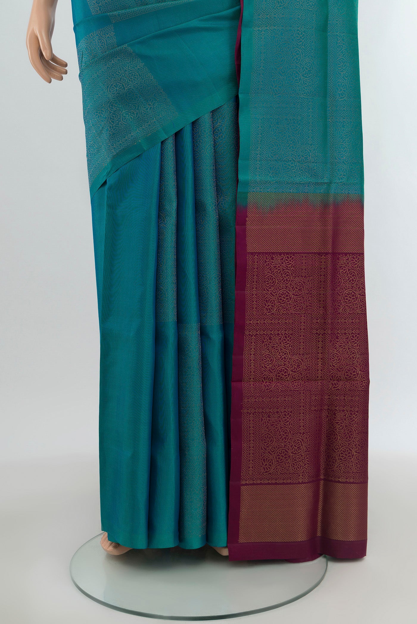 Pleats and pallu of Peacock Blue Soft Silk Saree with Plain Body and Without Border. 