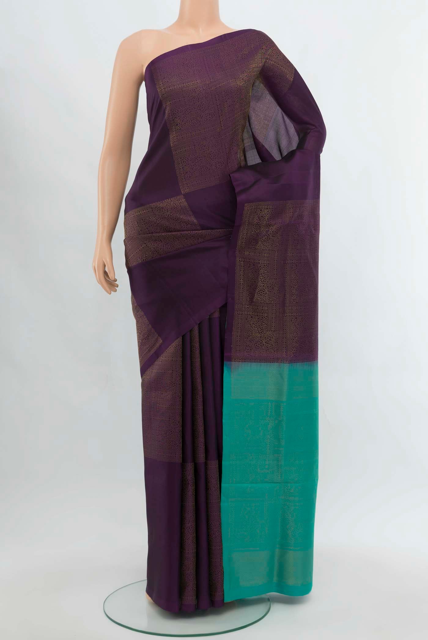 Purple Soft Silk Saree with Zari Butta on the body and Silk Border.  displayed on a mannequin