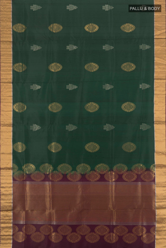 Flat view of Bottle Green Soft Silk Saree with Zari Butta on the body and Silk Border. 