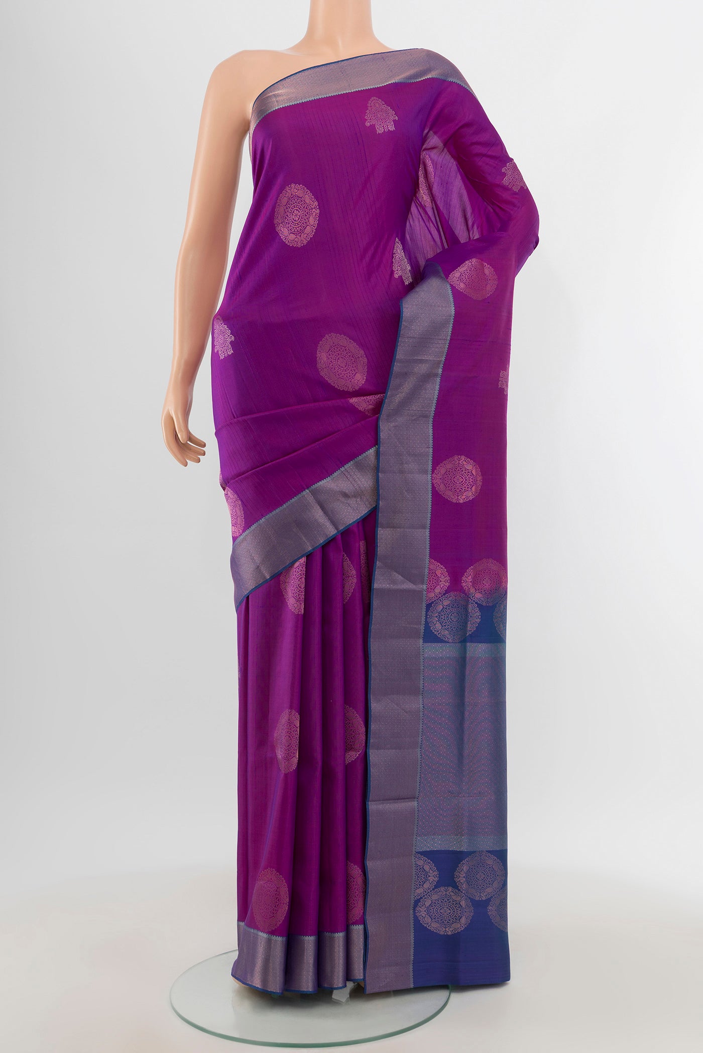 Violet Soft Silk Saree with Zari Butta on the body and Zari Border.  displayed on a mannequin