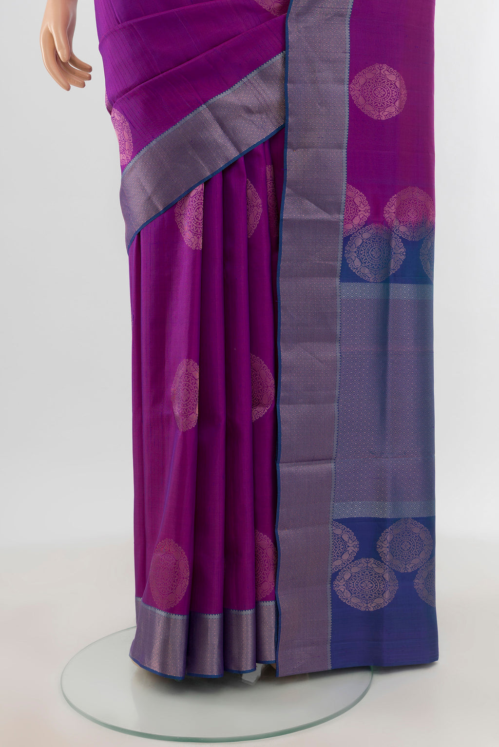 Pleats and pallu of Violet Soft Silk Saree with Zari Butta on the body and Zari Border. 
