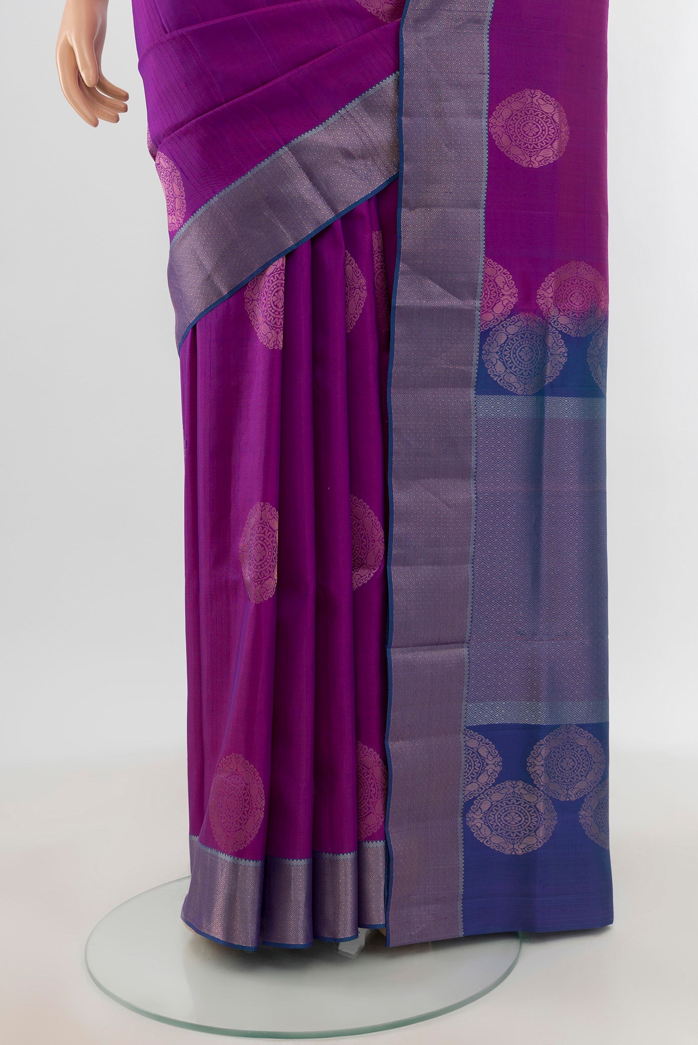 Pleats and pallu of Violet Soft Silk Saree with Zari Butta on the body and Zari Border. 