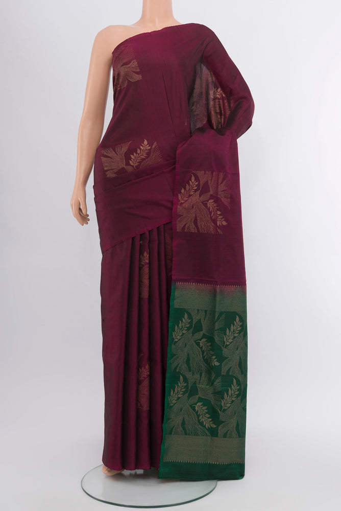 Purple Soft Silk Saree with Zari Butta on the body and Silk Border.  displayed on a mannequin