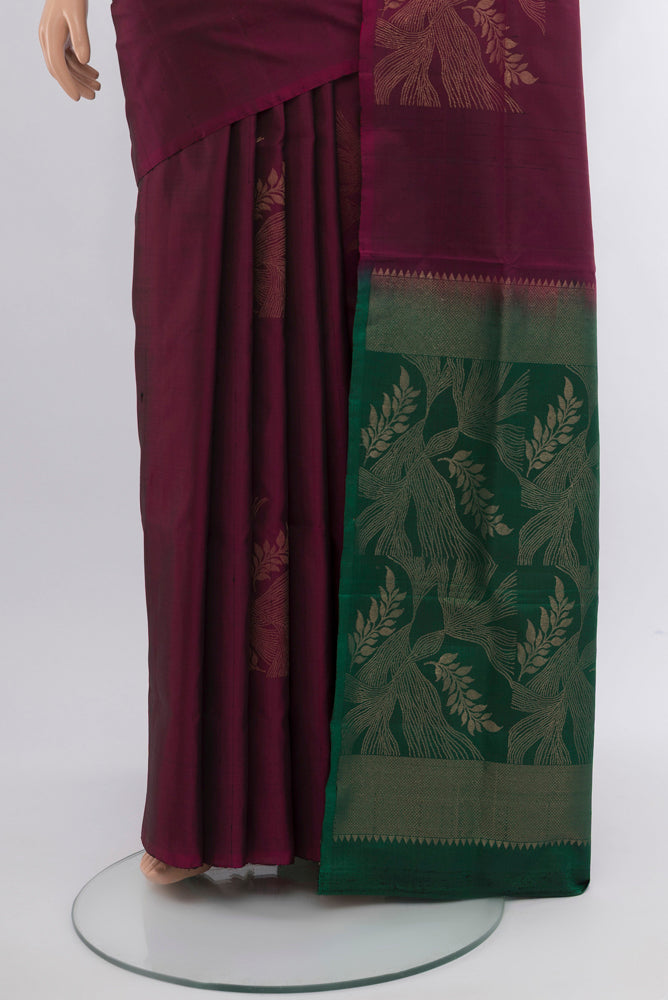Pleats and pallu of Purple Soft Silk Saree with Zari Butta on the body and Silk Border. 