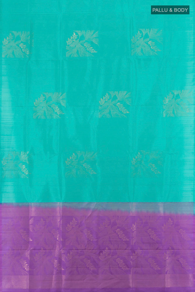 Flat view of Sky Blue Soft Silk Saree with Zari Butta on the body and Zari Border. 