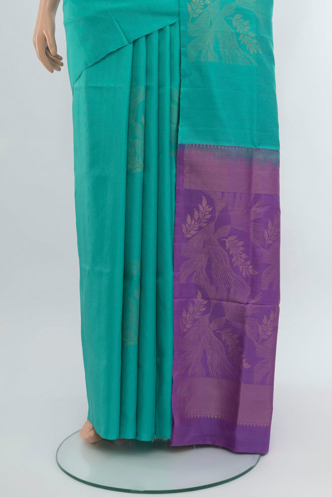 Pleats and pallu of Sky Blue Soft Silk Saree with Zari Butta on the body and Zari Border. 