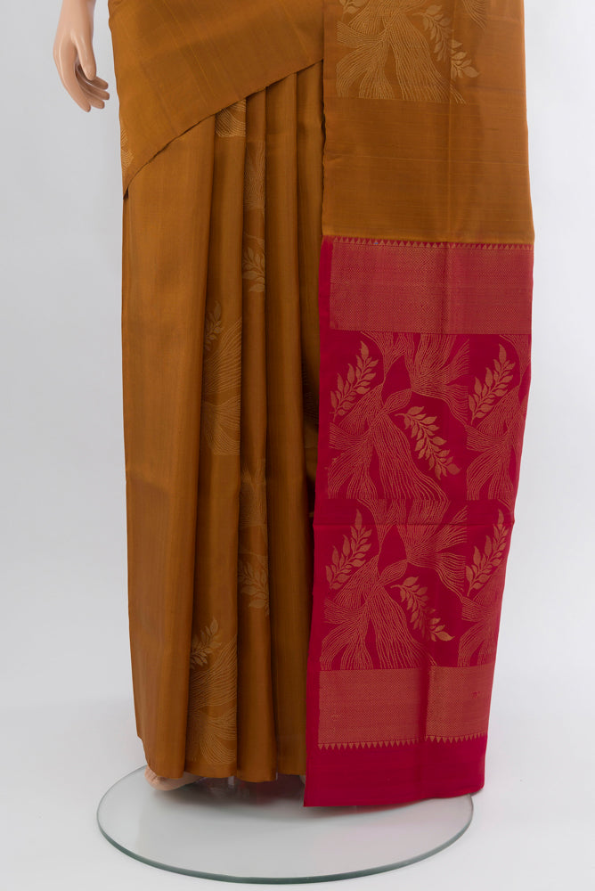 Pleats and pallu of Brown Soft Silk Saree with Zari Butta on the body and Silk Border. 