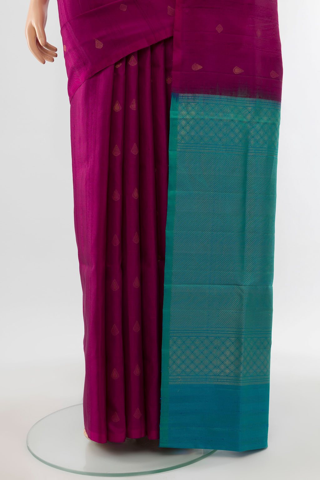 Pleats and pallu of Purple Soft Silk Saree with Zari Butta on the body and Silk Border. 