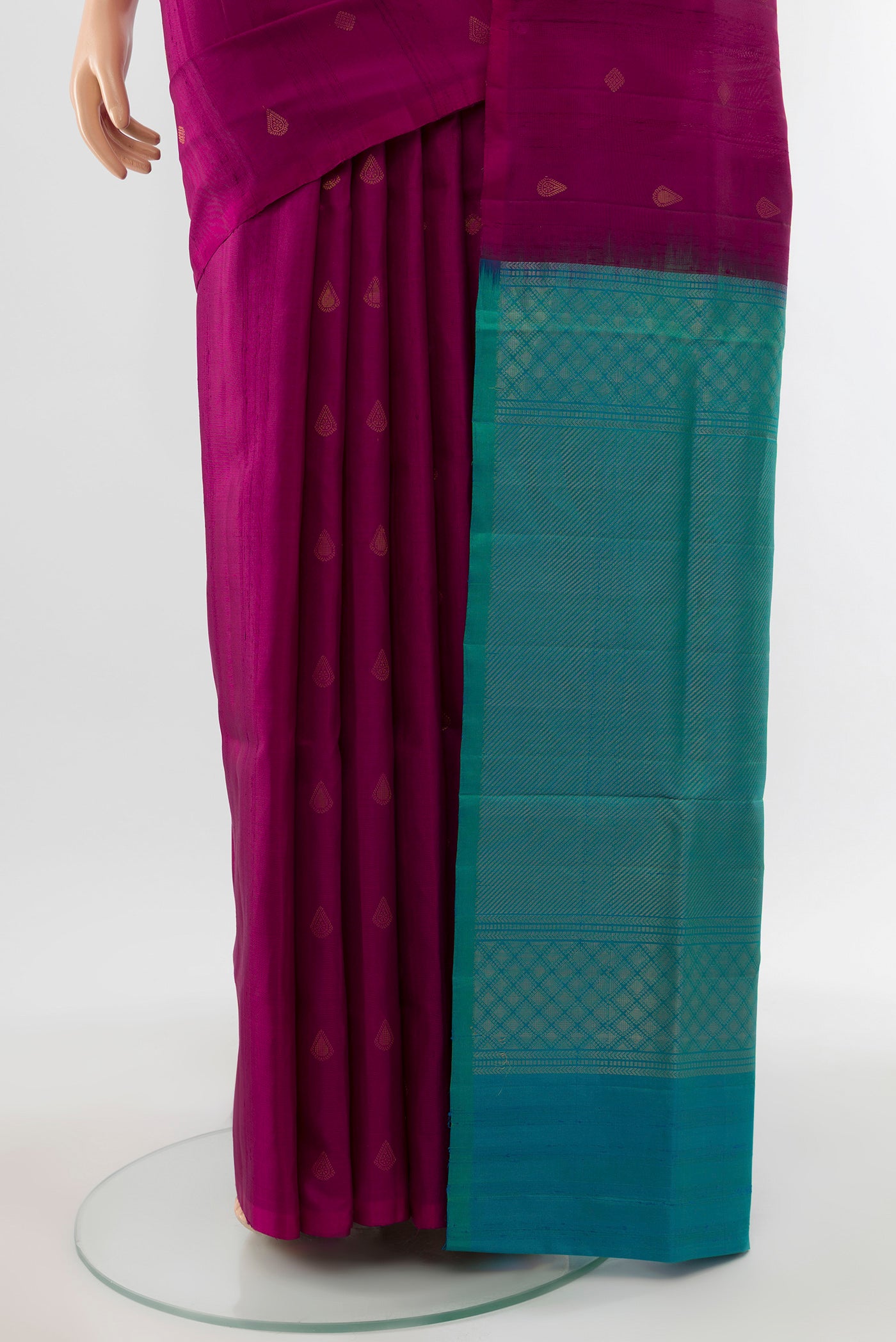 Pleats and pallu of Purple Soft Silk Saree with Zari Butta on the body and Silk Border. 