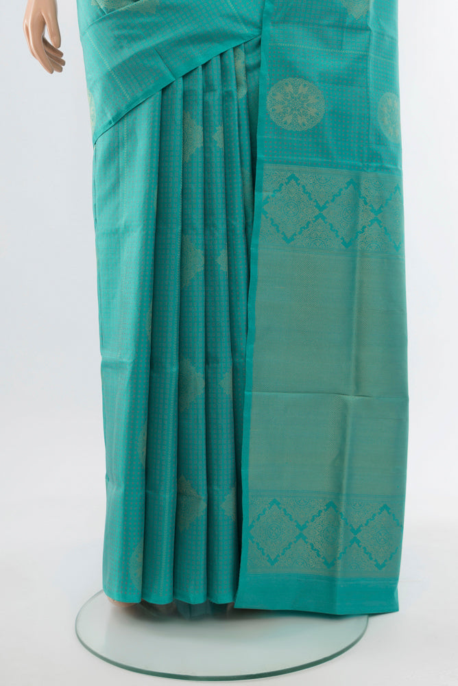 Pleats and pallu of Sky Blue Soft Silk Saree with Zari Butta on the body and Silk Border. 
