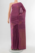 Bronze Soft Silk Saree with Zari Butta on the body and Silk Border.  displayed on a mannequin